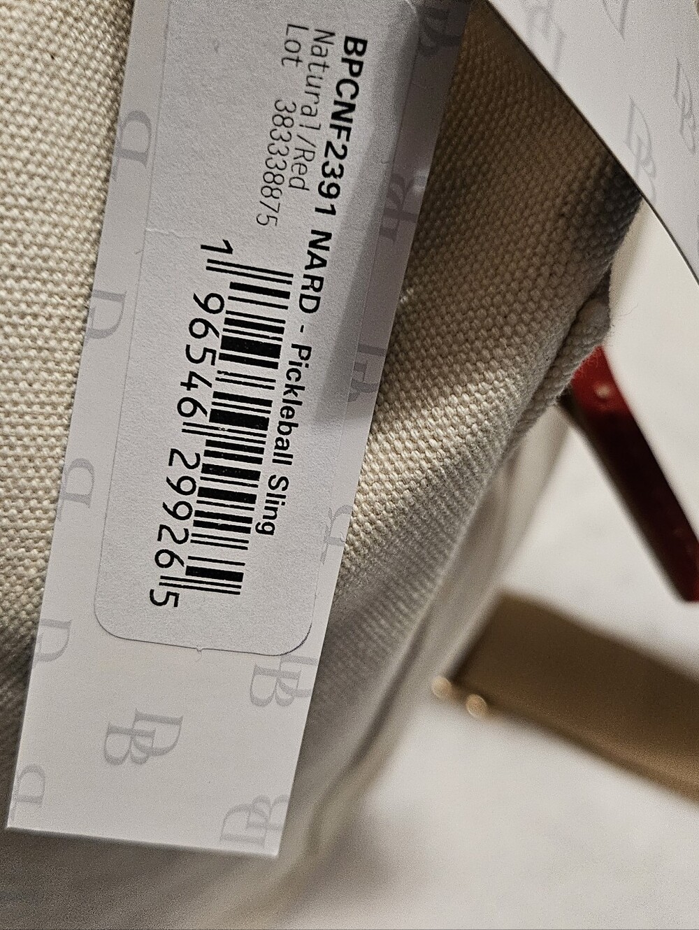 Dooney & Burke Natural Canvas Sling with Red Tab